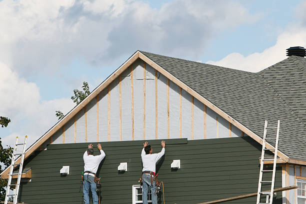 Professional Siding Installation technician working in Concord, MA